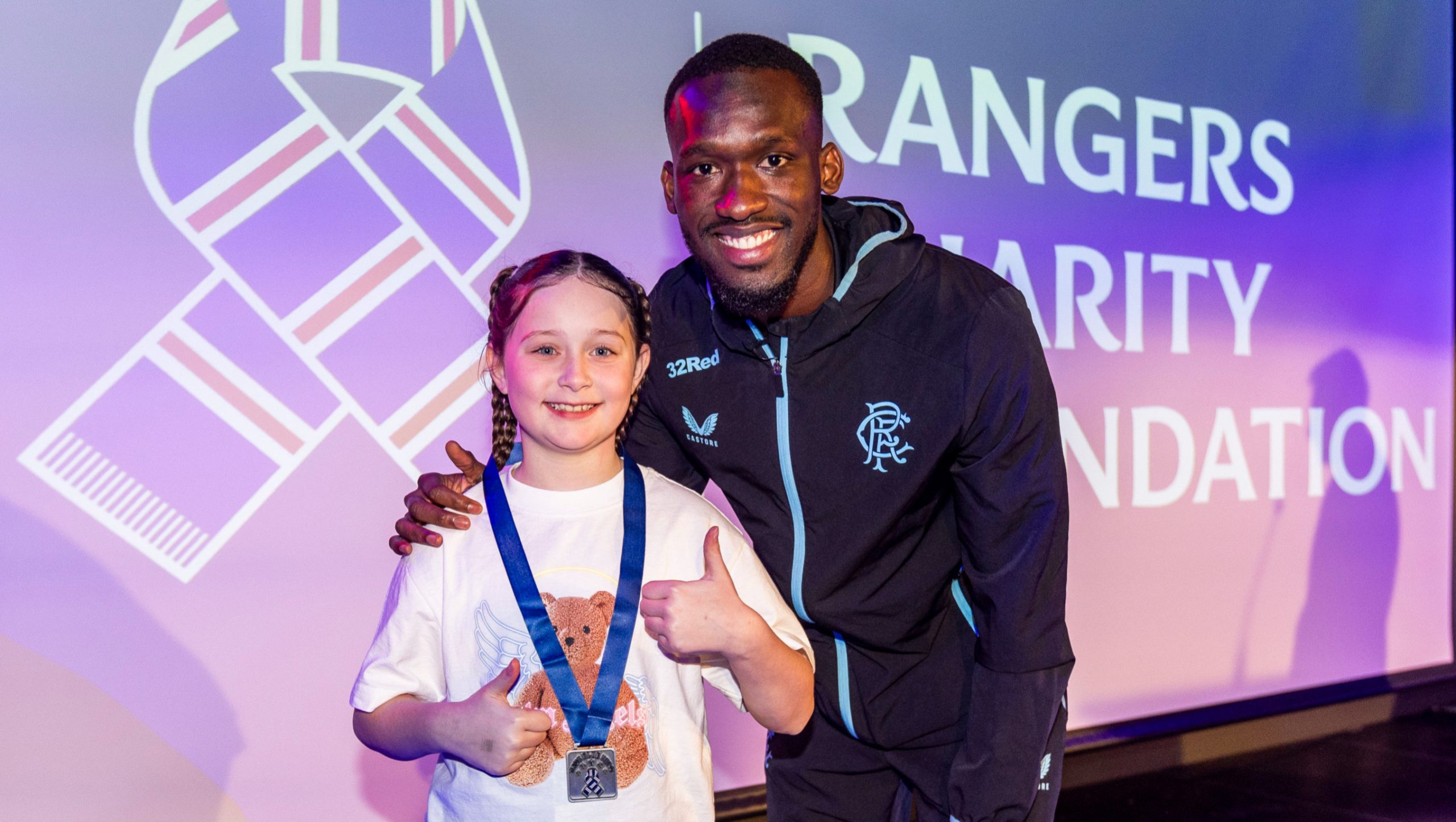 player and fan with medal