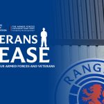 The Veterans At Ease logo with a man abseiling from Ibrox Stadium
