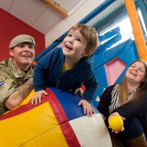 kid with parents, one of which is a soldier